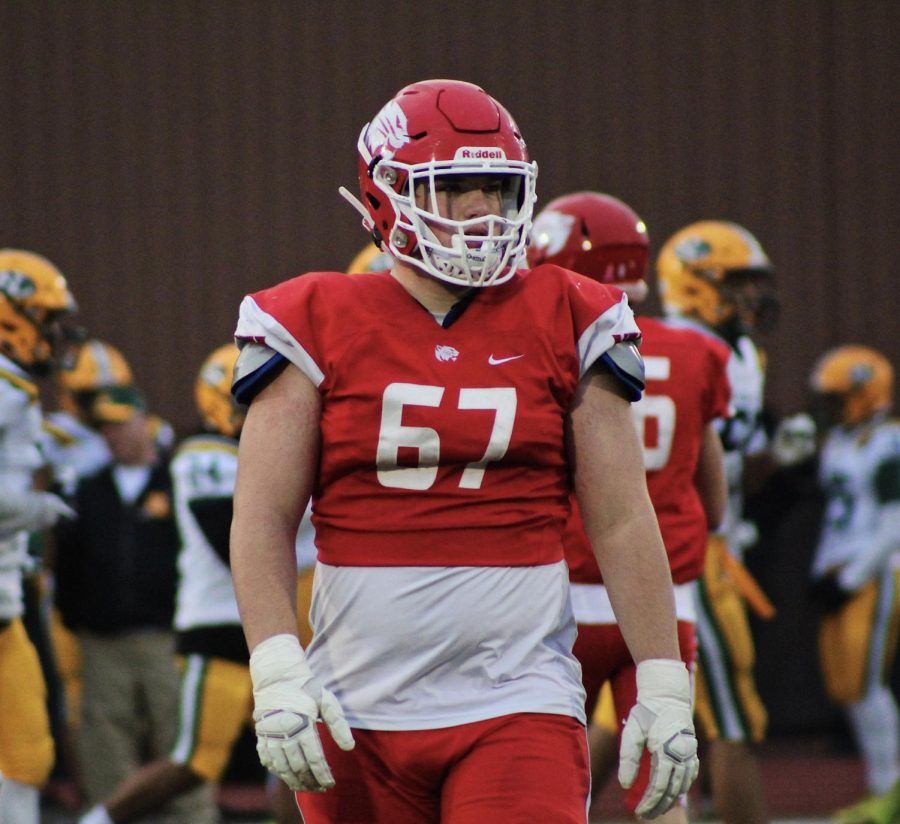 Offensive Tackle, Joe Klick, 21 glaces at the NFA sideline.