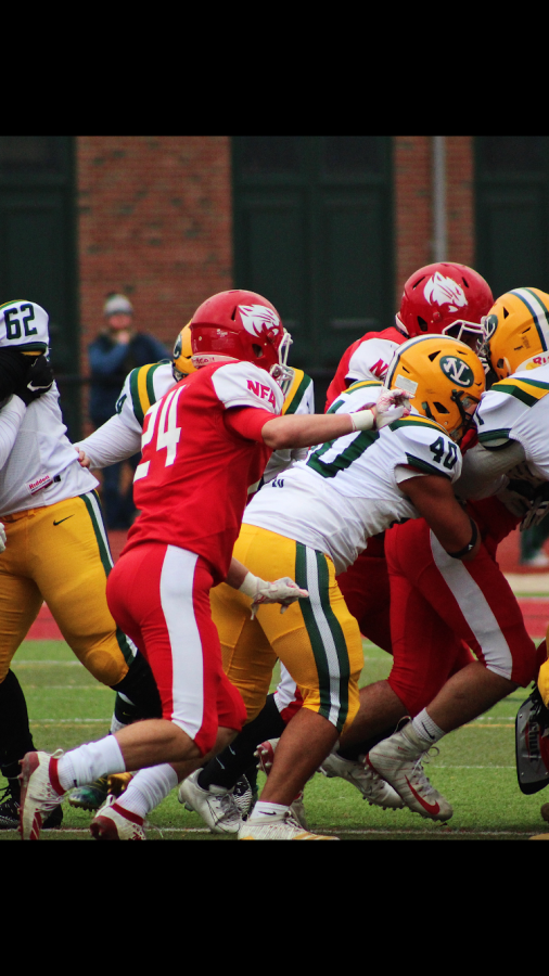 Nathan Cote, '20 aiding teammates mid-game.