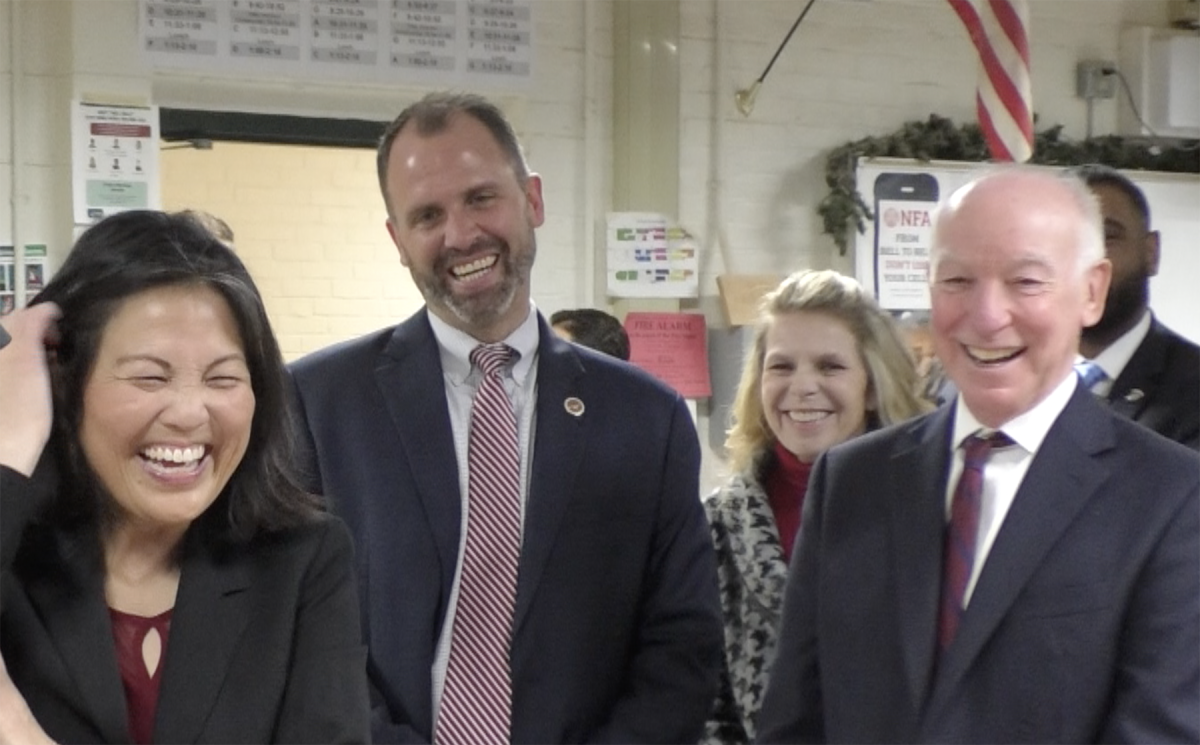 Acting U.S. Secretary of Labor Julie Su (left) shares a laugh with Congressman Joe Courtney (right), NFA Head of School Nathan Quesnel (second from left) and Linda Farinha (second from right), head of NFA's College and Career Center, as a student demonstrates the proper use of a manufacturing machine.